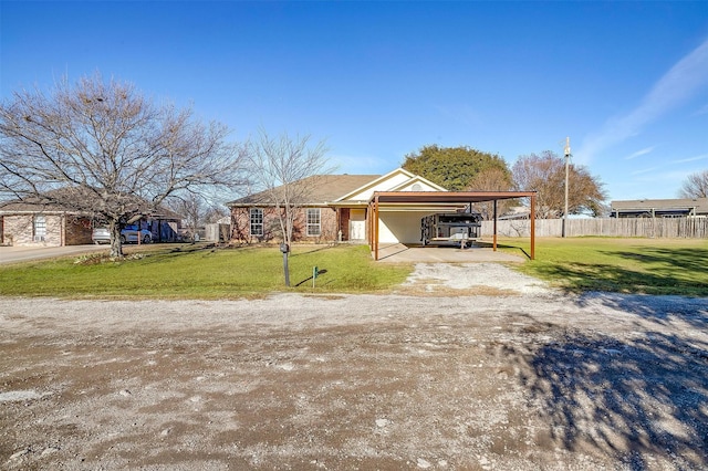 view of front facade featuring a front lawn and a carport