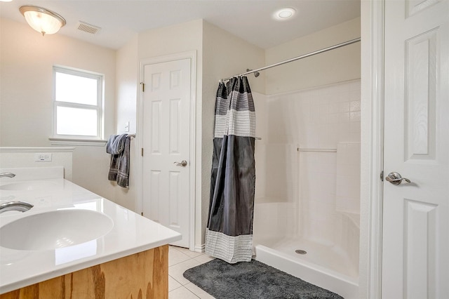 bathroom with vanity, tile patterned flooring, and a shower with curtain