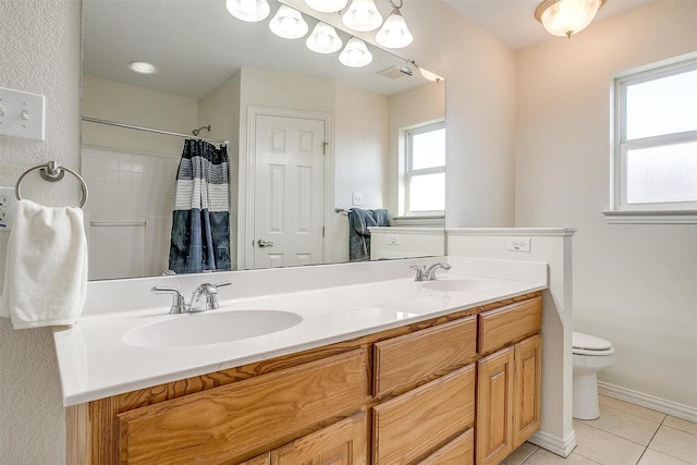 bathroom featuring vanity, a shower with curtain, tile patterned floors, and toilet