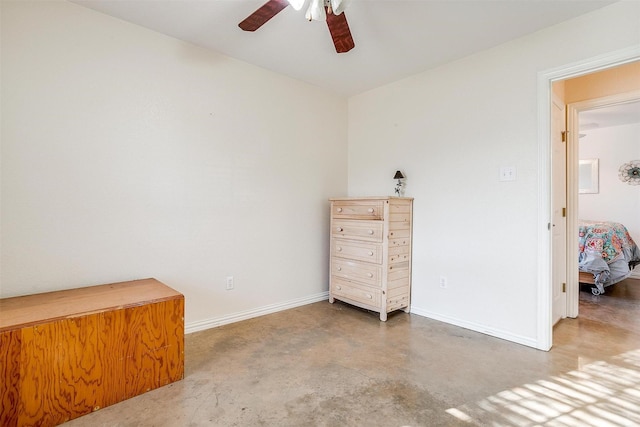 bedroom with concrete flooring and ceiling fan