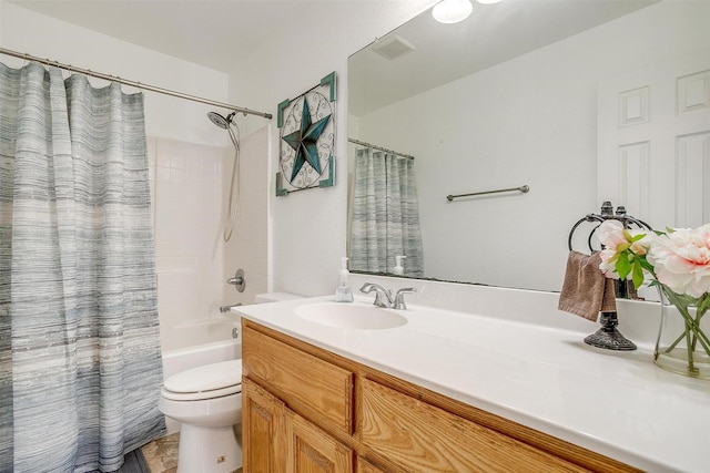 full bathroom with shower / bath combo with shower curtain, vanity, and toilet