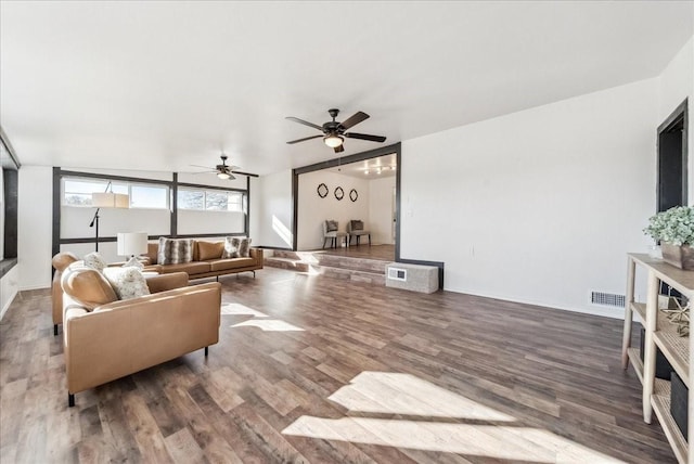 living room featuring hardwood / wood-style flooring and ceiling fan