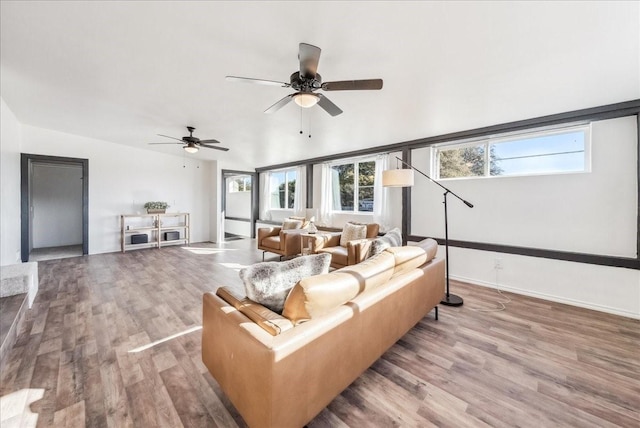 living room with ceiling fan and wood-type flooring