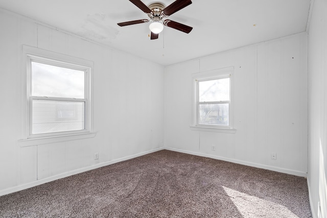 carpeted empty room with ceiling fan