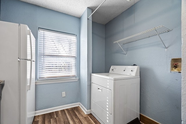 laundry area with washer / clothes dryer, a textured ceiling, and dark hardwood / wood-style flooring