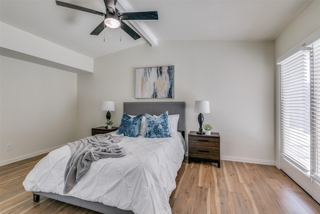 bedroom featuring light hardwood / wood-style flooring, lofted ceiling with beams, and ceiling fan