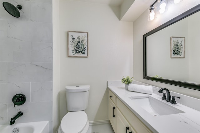 full bathroom featuring vanity, tiled shower / bath combo, and toilet