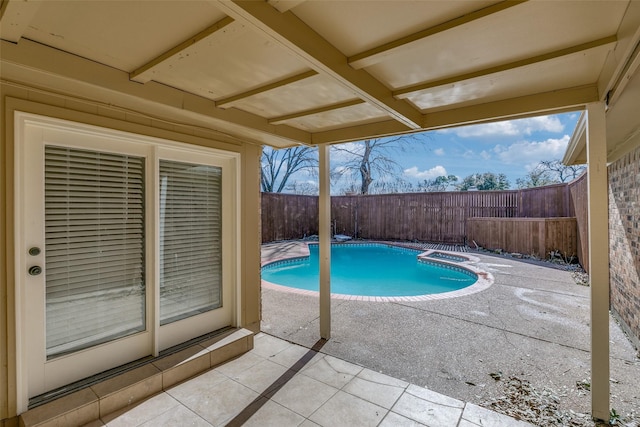 view of pool featuring an in ground hot tub and a patio area