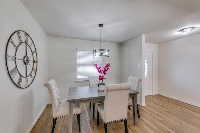 dining space with light wood-type flooring