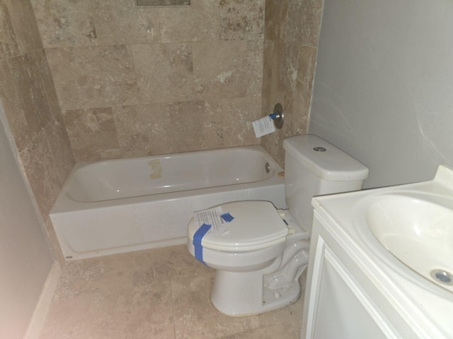 bathroom with tile patterned floors, vanity, and toilet