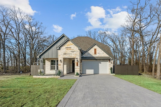 view of front of house with a garage and a front lawn