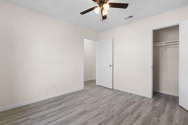 unfurnished bedroom featuring a closet, ceiling fan, and light hardwood / wood-style floors