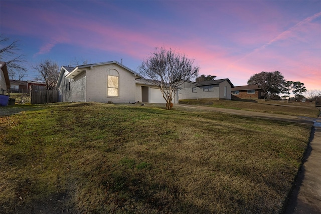 ranch-style home featuring a yard