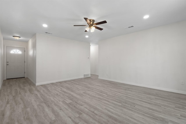 unfurnished room featuring ceiling fan and light wood-type flooring