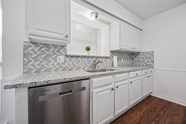 kitchen with white cabinets, dark wood-type flooring, sink, and dishwasher