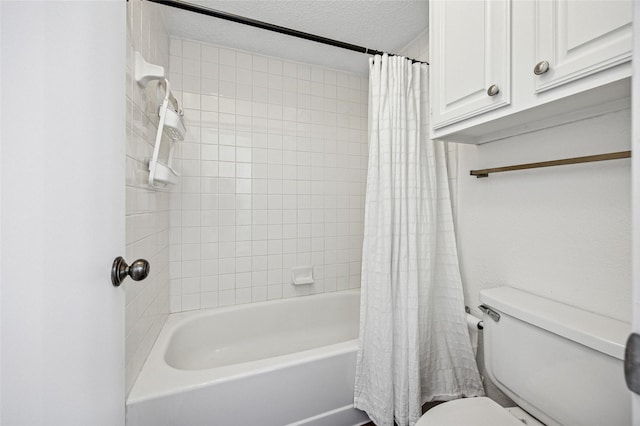 bathroom with toilet, shower / bathtub combination with curtain, and a textured ceiling