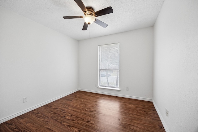 unfurnished room with ceiling fan, a textured ceiling, and dark hardwood / wood-style flooring