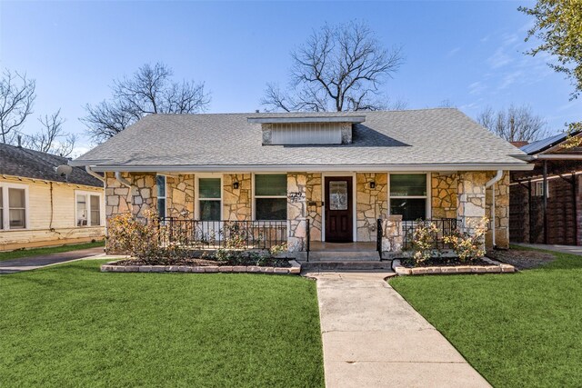 bungalow-style house featuring a porch and a front lawn