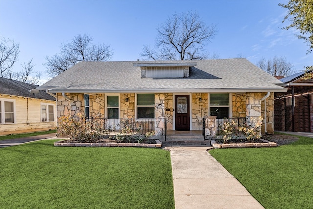 bungalow-style house with a porch and a front lawn