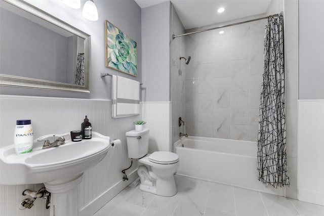 bathroom with toilet and shower / bath combo with shower curtain