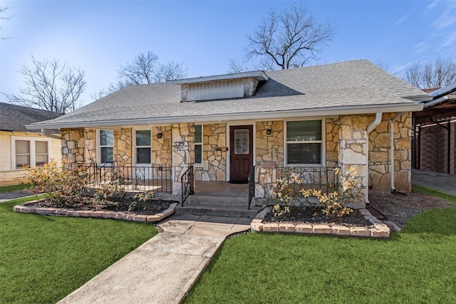 view of front of home featuring a porch and a front lawn