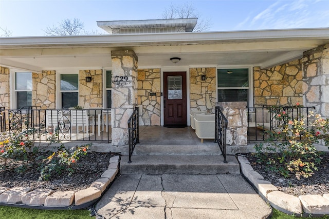 doorway to property featuring covered porch