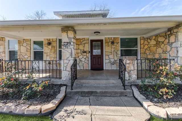 doorway to property with a porch