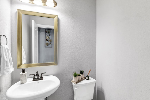 bathroom with sink and toilet