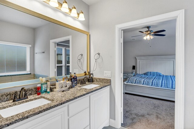 bathroom featuring ceiling fan and vanity