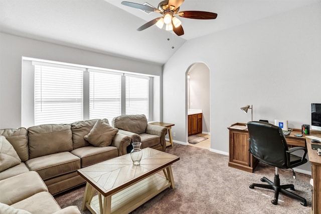 home office featuring lofted ceiling, light carpet, and ceiling fan