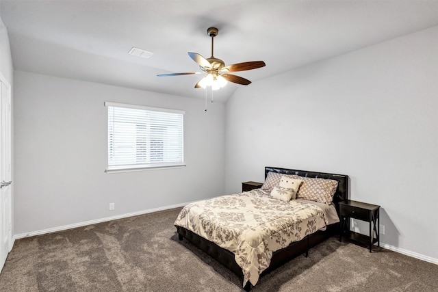 carpeted bedroom with vaulted ceiling and ceiling fan