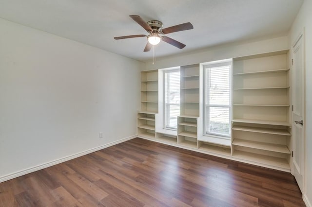 unfurnished room with ceiling fan and dark hardwood / wood-style flooring