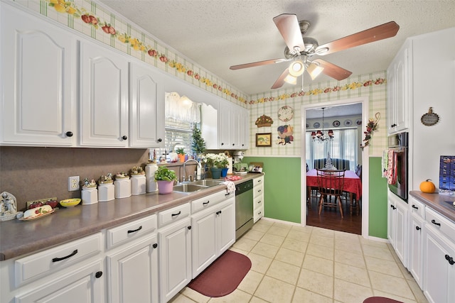 kitchen with stainless steel appliances, ceiling fan, sink, white cabinetry, and light tile patterned flooring