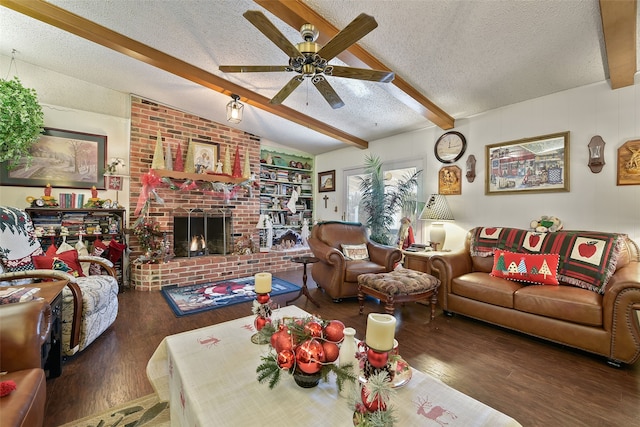 living room featuring a textured ceiling, dark hardwood / wood-style floors, a fireplace, ceiling fan, and vaulted ceiling with beams