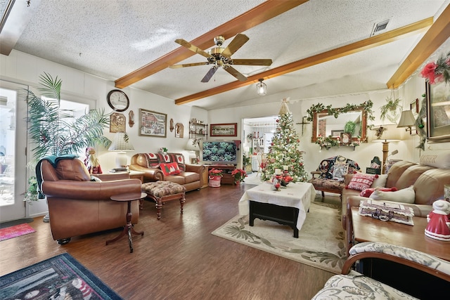 living room featuring a textured ceiling, ceiling fan, vaulted ceiling with beams, and dark hardwood / wood-style floors