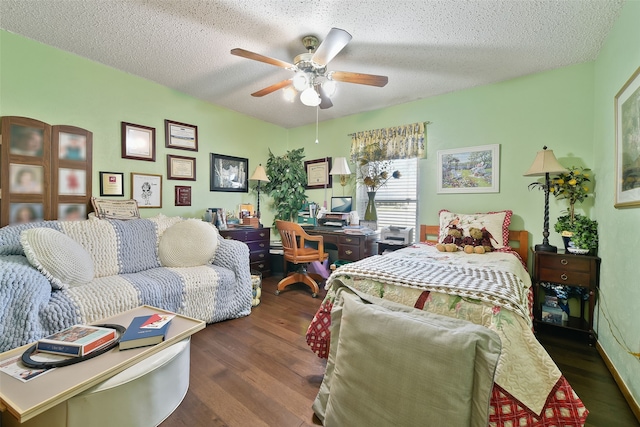 bedroom with a textured ceiling, ceiling fan, and dark wood-type flooring