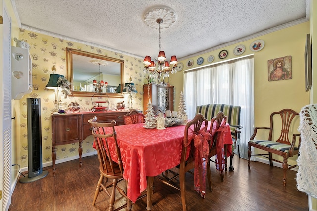 dining space featuring crown molding, dark wood-type flooring, an inviting chandelier, and a textured ceiling