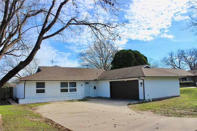 single story home with fence, a garage, and driveway