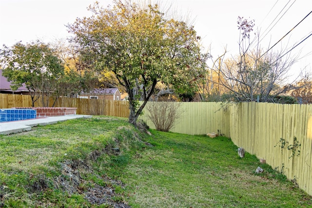 view of yard with a fenced backyard and a fenced in pool