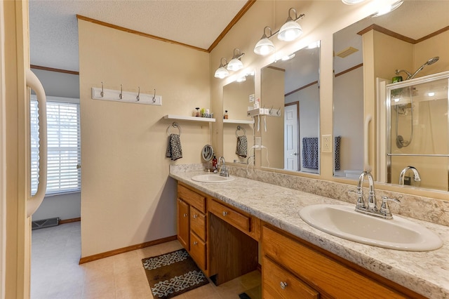 bathroom with walk in shower, vanity, a textured ceiling, and crown molding