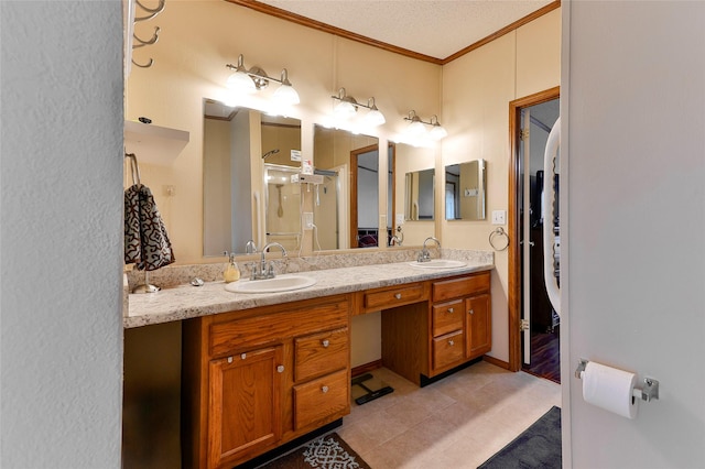 bathroom featuring vanity, tile patterned flooring, a textured ceiling, and crown molding