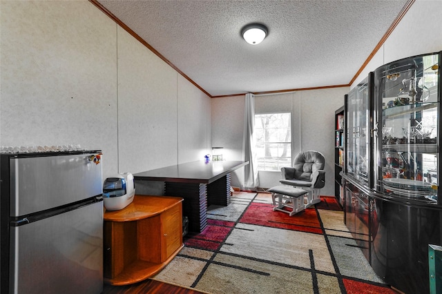 office space featuring vaulted ceiling, a textured ceiling, and ornamental molding