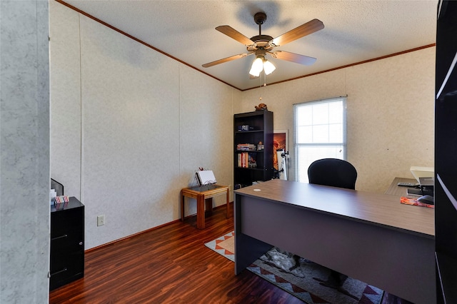 office area featuring a textured ceiling, ornamental molding, ceiling fan, and dark wood-type flooring