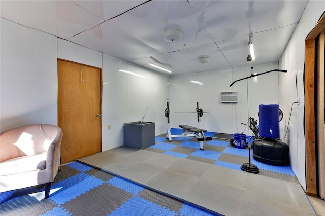 exercise area with a wall mounted air conditioner