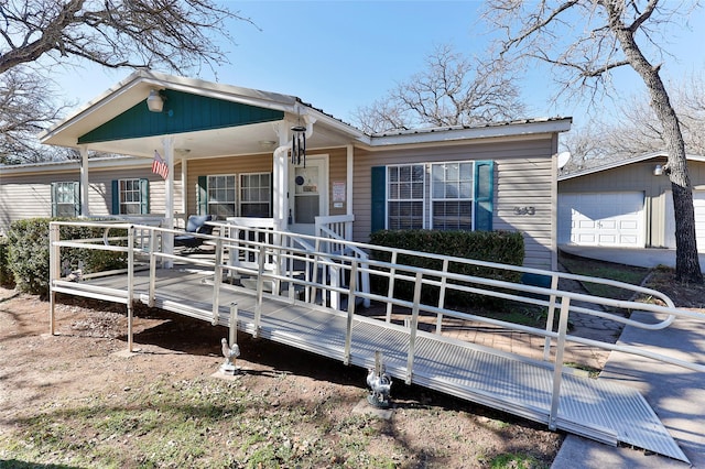 view of front of house featuring a garage and covered porch