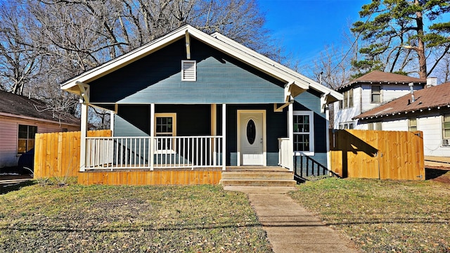 bungalow-style house featuring a front yard