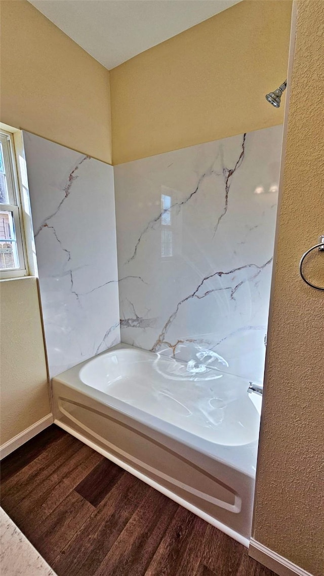 bathroom with hardwood / wood-style floors