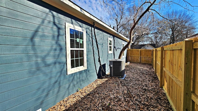 view of side of home featuring central air condition unit