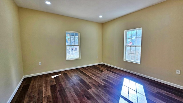 unfurnished room with dark hardwood / wood-style floors