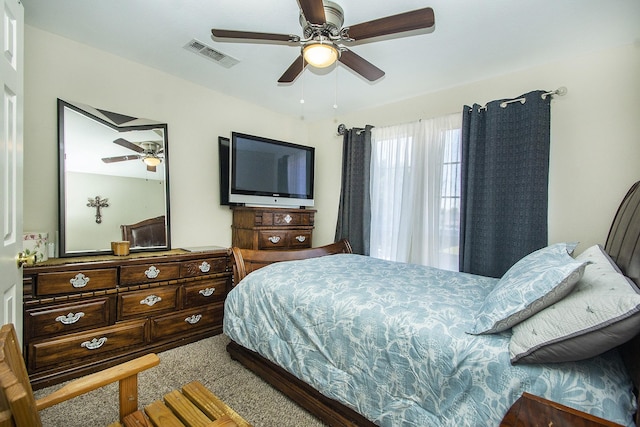 bedroom featuring ceiling fan and carpet floors